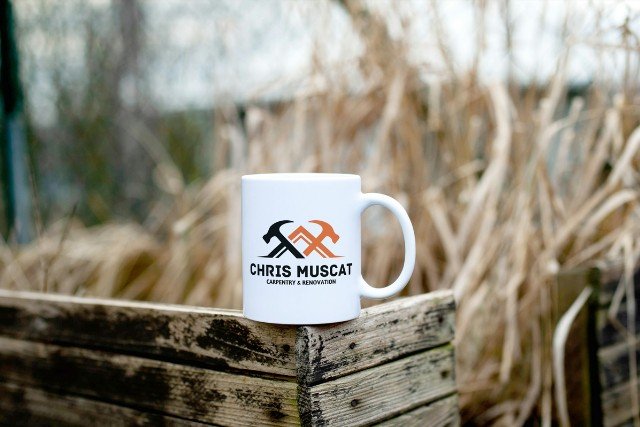 White mug with logo.