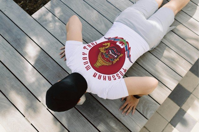 Man training and wearing t-shirt with red logo.