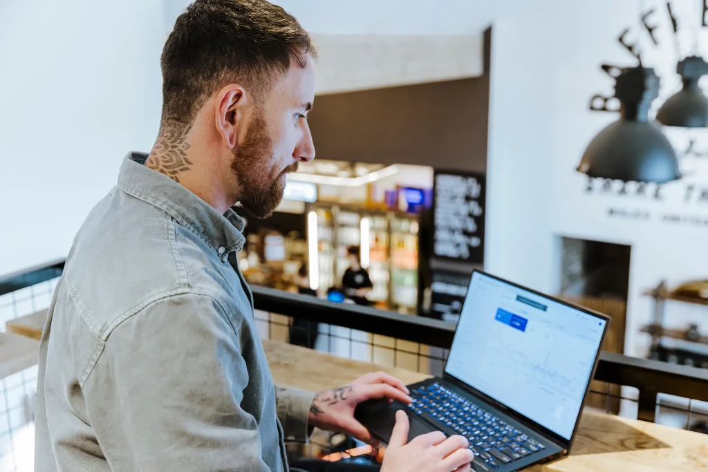 Petr Zajkas, founder of Appvalanche Digital, working on a client website on his laptop.
